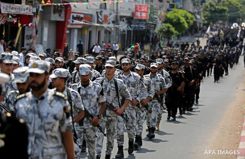 Members of Palestinian forces in Gaza strip take part in a military parade in Gaza City on July 26, 2017 as a tense standoff is underway between Israel and Muslim worshippers at Jerusalem's Al-Aqsa compound. Muslims have...