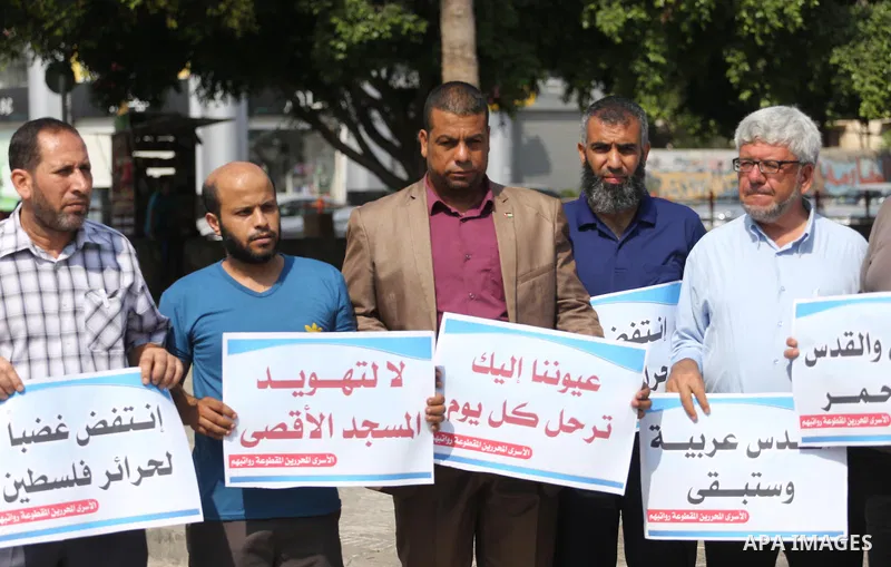 Palestinians take part in a protest against Israel's newly-installed security measures at the entrance to the al-Aqsa mosque compound, in Gaza city on July 27, 2017. Photo by Mohammed Asad