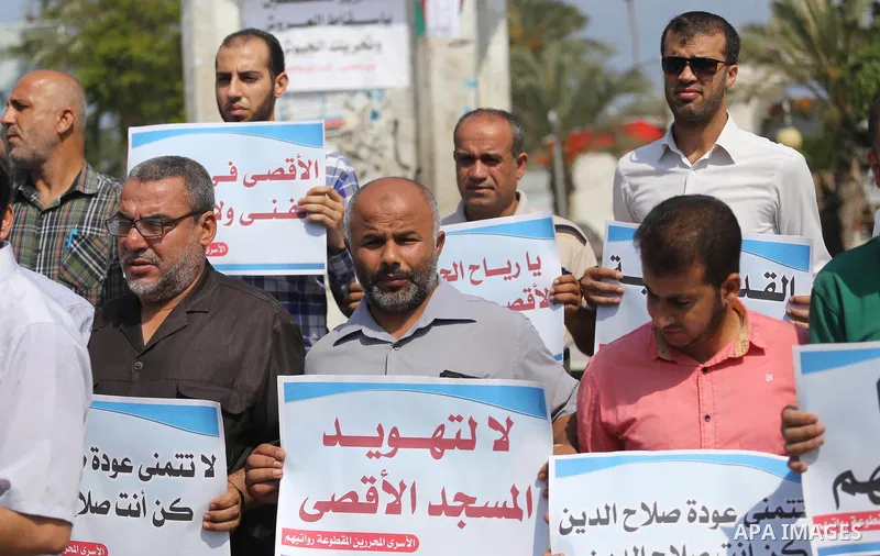 Palestinians take part in a protest against Israel's newly-installed security measures at the entrance to the al-Aqsa mosque compound, in Gaza city on July 27, 2017. Photo by Mohammed Asad