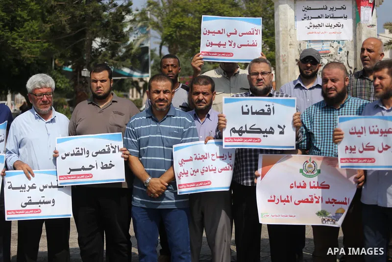 Palestinians take part in a protest against Israel's newly-installed security measures at the entrance to the al-Aqsa mosque compound, in Gaza city on July 27, 2017. Photo by Mohammed Asad