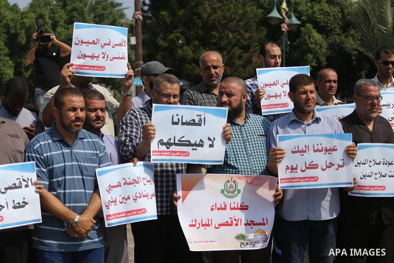 Palestinians take part in a protest against Israel's newly-installed security measures at the entrance to the al-Aqsa mosque compound, in Gaza city on July 27, 2017. Photo by Mohammed Asad