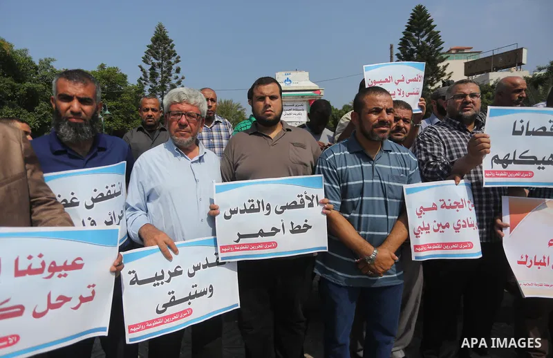 Palestinians take part in a protest against Israel's newly-installed security measures at the entrance to the al-Aqsa mosque compound, in Gaza city on July 27, 2017. Photo by Mohammed Asad