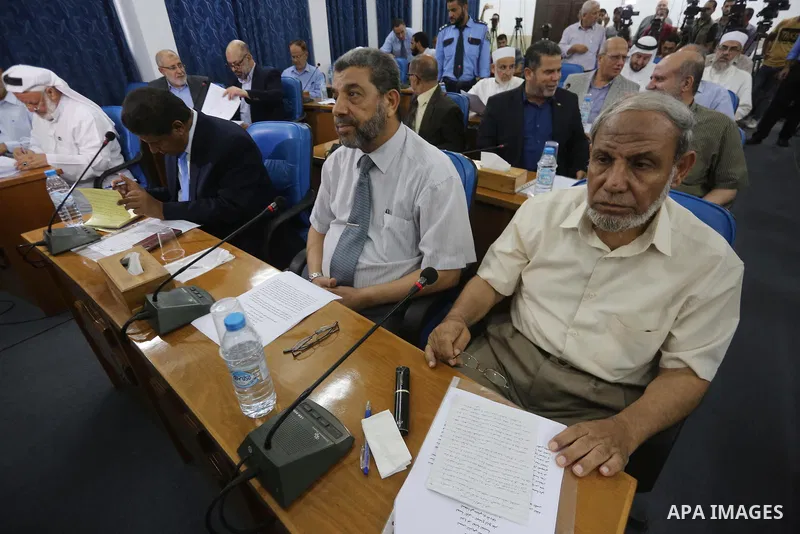 Members of the Palestinian legislative council from Hamas movement attend a meeting at the legislative council, in Gaza city on July 27, 2017. Photo by Mohammed Asad