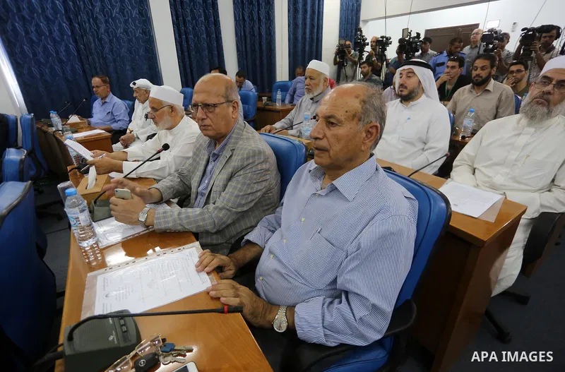 Members of the Palestinian legislative council from Hamas movement attend a meeting at the legislative council, in Gaza city on July 27, 2017. Photo by Mohammed Asad