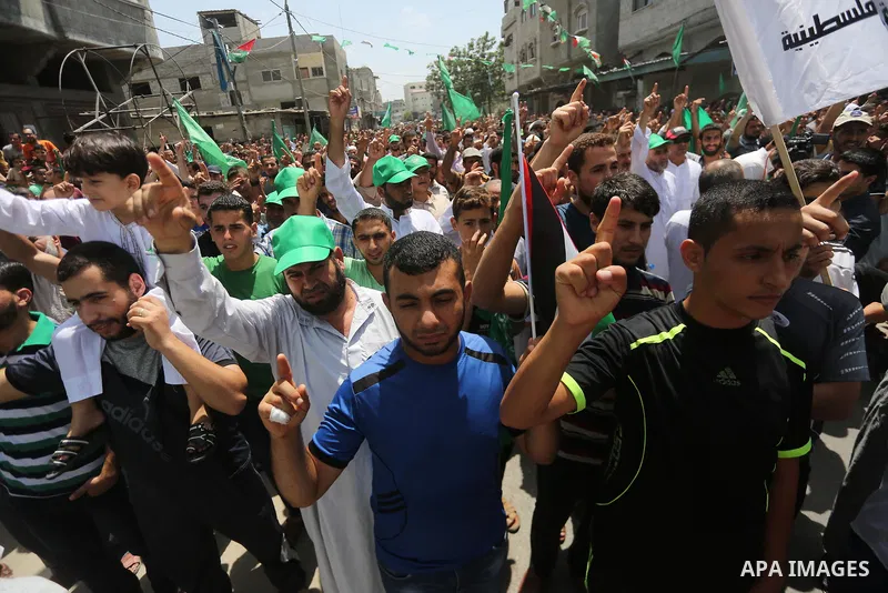 Palestinian supporters of Hamas movement and Islamic Jihad take part in a protest against the recent closure of the Al-Aqsa Mosque compound by Israel, in Jabalia refugee camp in the northern Gaza strip, on July 23, 2017....