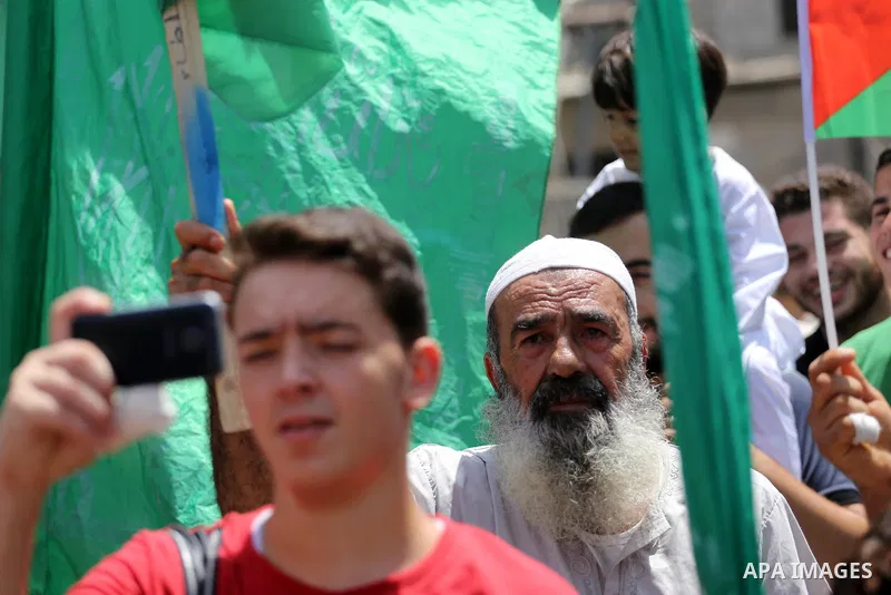 Palestinian supporters of Hamas movement and Islamic Jihad take part in a protest against the recent closure of the Al-Aqsa Mosque compound by Israel, in Jabalia refugee camp in the northern Gaza strip, on July 23, 2017....