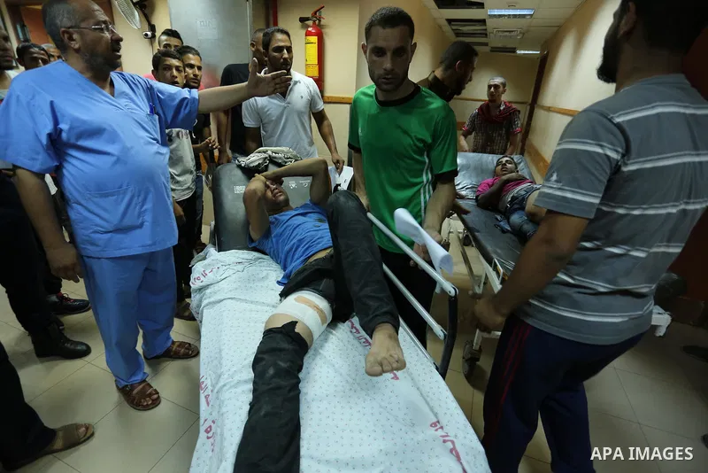 Injured Palestinian protesters, who were wounded during clashes with the Israeli army along the Gaza border, recieves treatment at a hospital in Deir al-Balah in the central Gaza strip on July 28, 2017. Photo by Ashraf A...