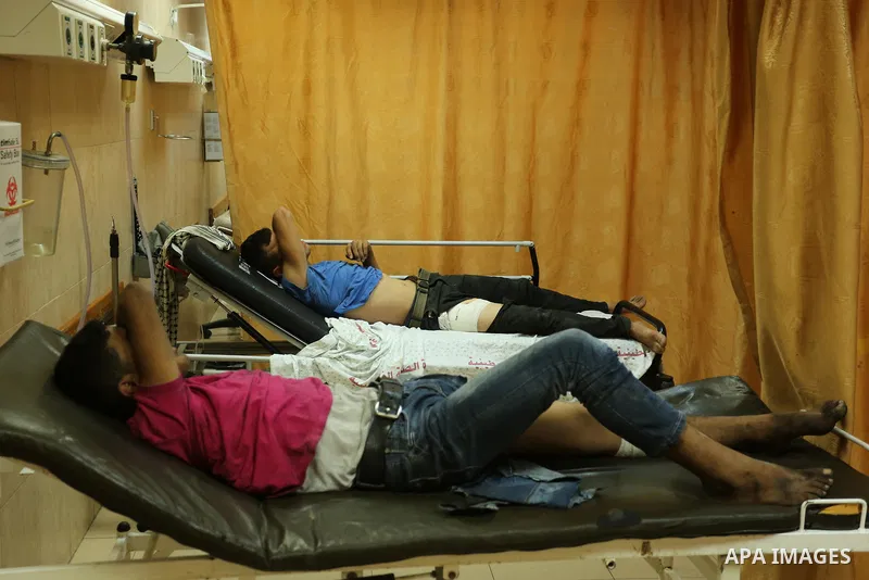 Injured Palestinian protesters, who were wounded during clashes with the Israeli army along the Gaza border, recieves treatment at a hospital in Deir al-Balah in the central Gaza strip on July 28, 2017. Photo by Ashraf A...
