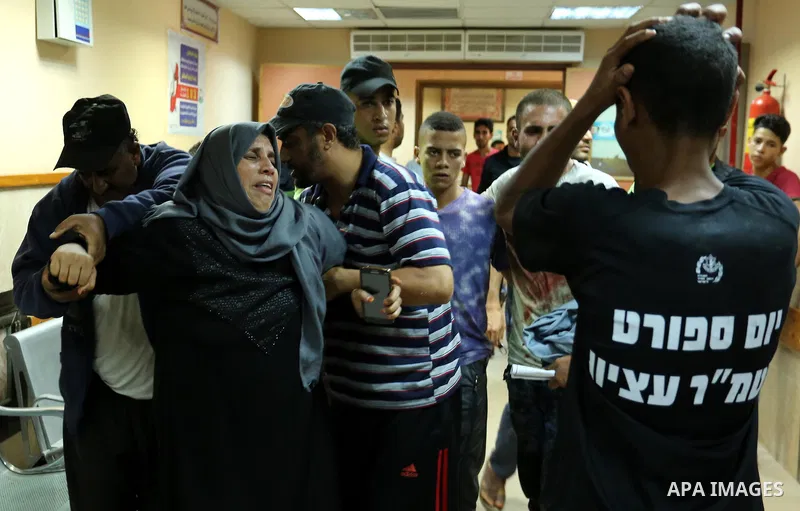 A Palestinian mother reacts after her son was killed in clashes with the Israeli army along the Gaza border at the Deir al-Balah hospital in the central Gaza Strip on July 28, 2017. Photo by Ashraf Amra