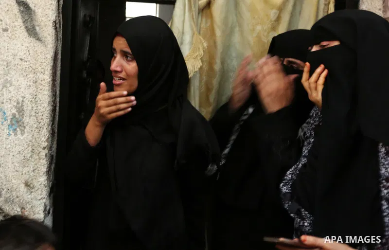 Palestinian relatives of 16 year old Abed Hussian Abu Hasimeh, who was shot dead by Israeli forces during clashes, cry during his funeral in the Bureij refugee camp in central Gaza on July 28, 2017. Israeli troops shot d...