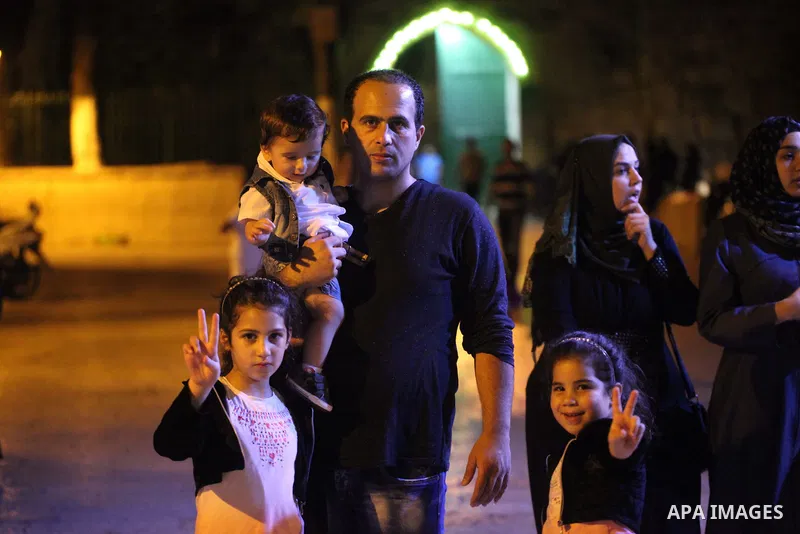 Palestinians celebrate marking Israel's removal of all security measures it had installed at the compound known to Muslims as Noble Sanctuary and to Jews as Temple Mount, in Jerusalem's Old City July 27, 2017. Photo by A...