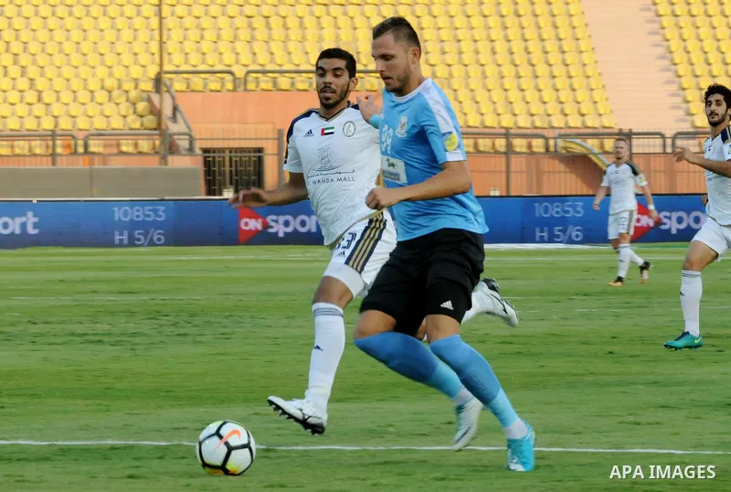 Jordan's Al-Faisaly players compete with UAE's Al-Wahda players during Arab Club championship at Al-Salam Stadium in Cairo, Egypt on July 28, 2017. Photo by Amr Sayed