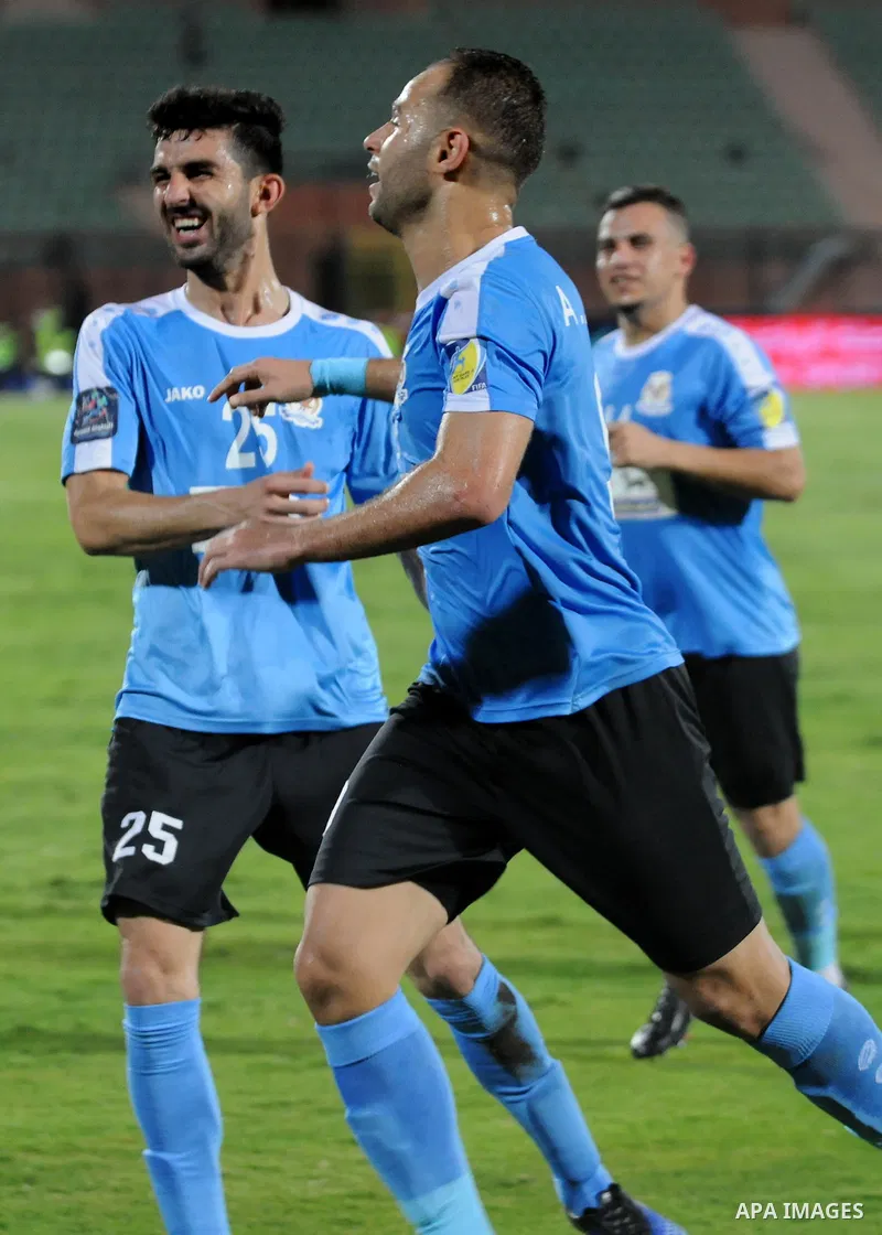 Jordan's Al-Faisaly players compete with UAE's Al-Wahda players during Arab Club championship at Al-Salam Stadium in Cairo, Egypt on July 28, 2017. Photo by Amr Sayed