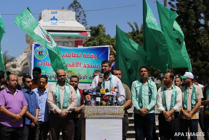 Palestinian supporters of Hamas movement take part during a rally to celebrate marking Israel's removal of all security measures it had installed that were implemented at the Al-Aqsa mosque compound in Jerusalem, in Gaza...