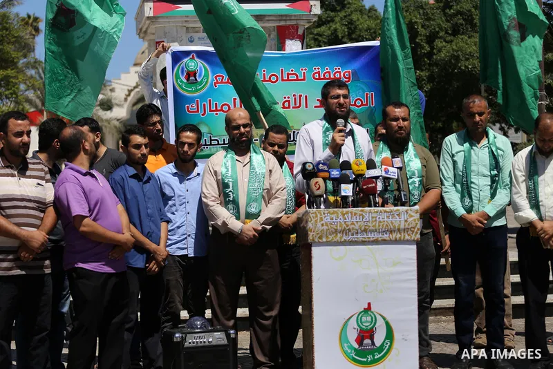 Palestinian supporters of Hamas movement take part during a rally to celebrate marking Israel's removal of all security measures it had installed that were implemented at the Al-Aqsa mosque compound in Jerusalem, in Gaza...