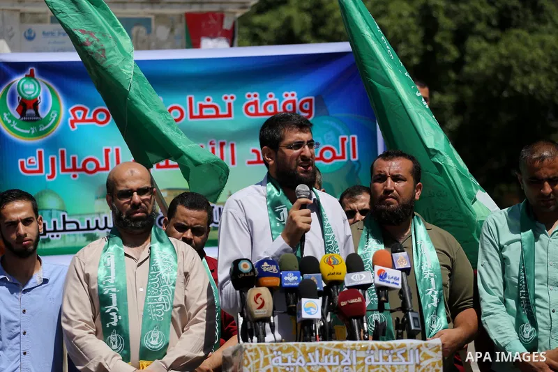 Palestinian supporters of Hamas movement take part during a rally to celebrate marking Israel's removal of all security measures it had installed that were implemented at the Al-Aqsa mosque compound in Jerusalem, in Gaza...