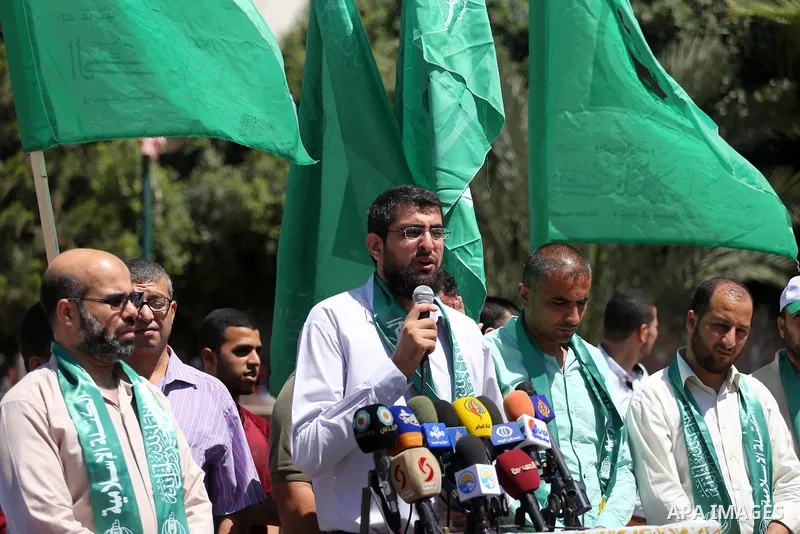 Palestinian supporters of Hamas movement take part during a rally to celebrate marking Israel's removal of all security measures it had installed that were implemented at the Al-Aqsa mosque compound in Jerusalem, in Gaza...