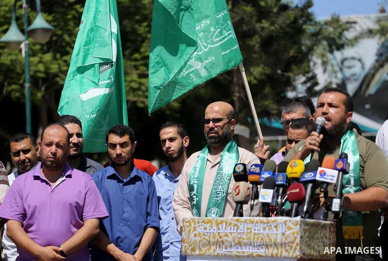 Palestinian supporters of Hamas movement take part during a rally to celebrate marking Israel's removal of all security measures it had installed that were implemented at the Al-Aqsa mosque compound in Jerusalem, in Gaza...