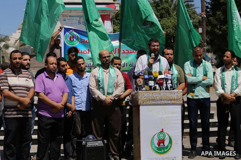 Palestinian supporters of Hamas movement take part during a rally to celebrate marking Israel's removal of all security measures it had installed that were implemented at the Al-Aqsa mosque compound in Jerusalem, in Gaza...