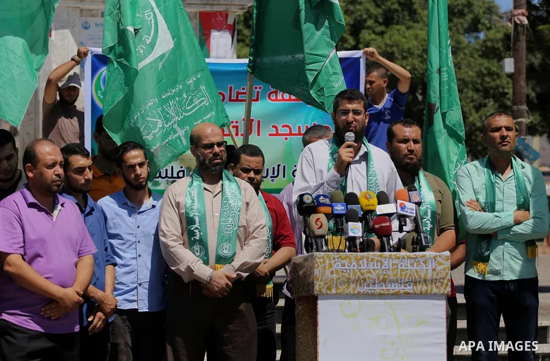 Palestinian supporters of Hamas movement take part during a rally to celebrate marking Israel's removal of all security measures it had installed that were implemented at the Al-Aqsa mosque compound in Jerusalem, in Gaza...