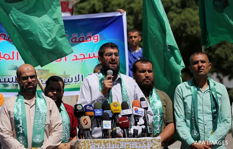 Palestinian supporters of Hamas movement take part during a rally to celebrate marking Israel's removal of all security measures it had installed that were implemented at the Al-Aqsa mosque compound in Jerusalem, in Gaza...