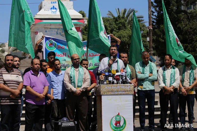Palestinian supporters of Hamas movement take part during a rally to celebrate marking Israel's removal of all security measures it had installed that were implemented at the Al-Aqsa mosque compound in Jerusalem, in Gaza...