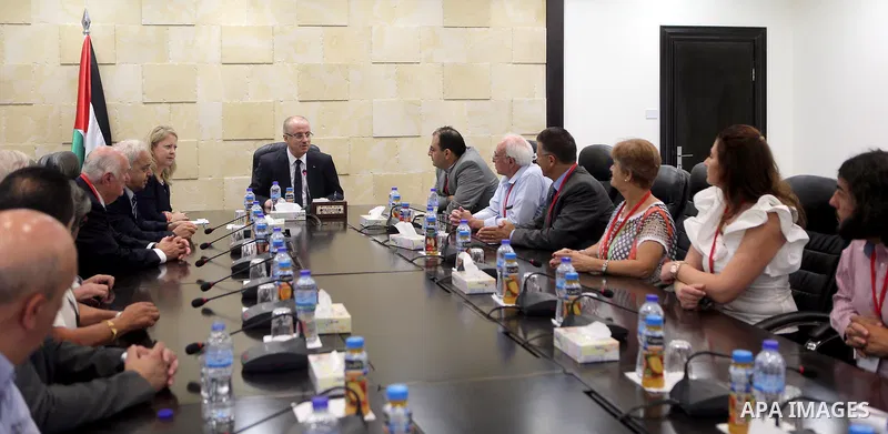 Palestinian Prime Minister Rami Hamdallah meets with a delegation from the union of Ramallah sons in America, in the West Bank city of Ramallah on July 30, 2017. Photo by Prime Minister Office