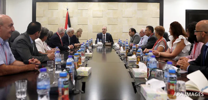 Palestinian Prime Minister Rami Hamdallah meets with a delegation from the union of Ramallah sons in America, in the West Bank city of Ramallah on July 30, 2017. Photo by Prime Minister Office