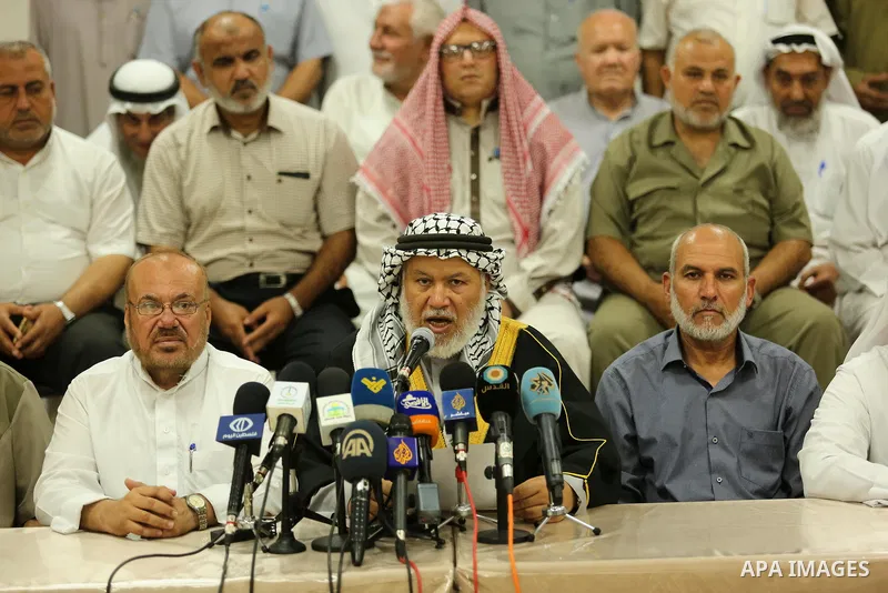 Marwan Abu Ras, a head of the Palestine Scholars Association, speaks during a press conference to show solidarity with Palestinians in Jerusalem, in Gaza city on July 30, 2017. Photo by Ashraf Amra
