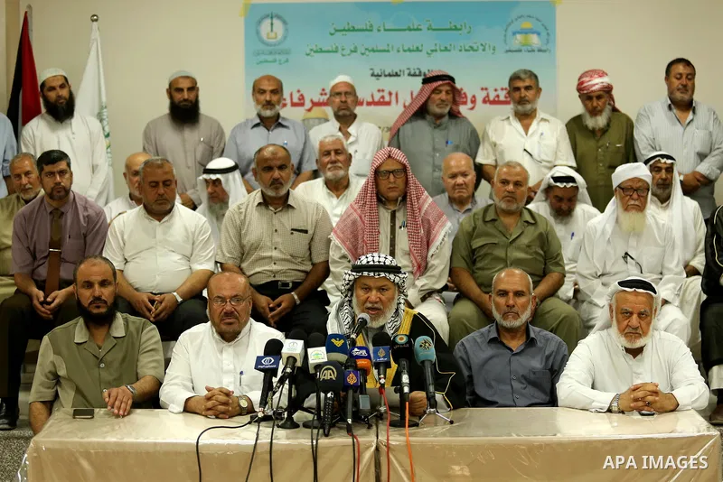 Marwan Abu Ras, a head of the Palestine Scholars Association, speaks during a press conference to show solidarity with Palestinians in Jerusalem, in Gaza city on July 30, 2017. Photo by Ashraf Amra