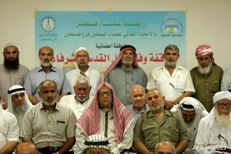 Members of Palestine Scholars Association attend a press conference to show solidarity with Palestinians in Jerusalem, in Gaza city on July 30, 2017. Photo by Ashraf Amra
