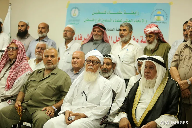 Members of Palestine Scholars Association attend a press conference to show solidarity with Palestinians in Jerusalem, in Gaza city on July 30, 2017. Photo by Ashraf Amra