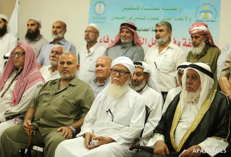 Members of Palestine Scholars Association attend a press conference to show solidarity with Palestinians in Jerusalem, in Gaza city on July 30, 2017. Photo by Ashraf Amra