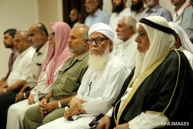 Members of Palestine Scholars Association attend a press conference to show solidarity with Palestinians in Jerusalem, in Gaza city on July 30, 2017. Photo by Ashraf Amra