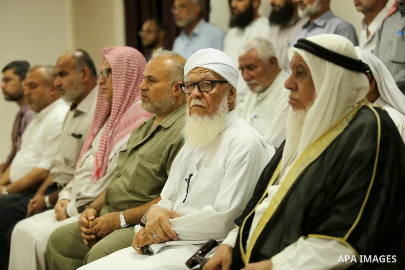 Members of Palestine Scholars Association attend a press conference to show solidarity with Palestinians in Jerusalem, in Gaza city on July 30, 2017. Photo by Ashraf Amra