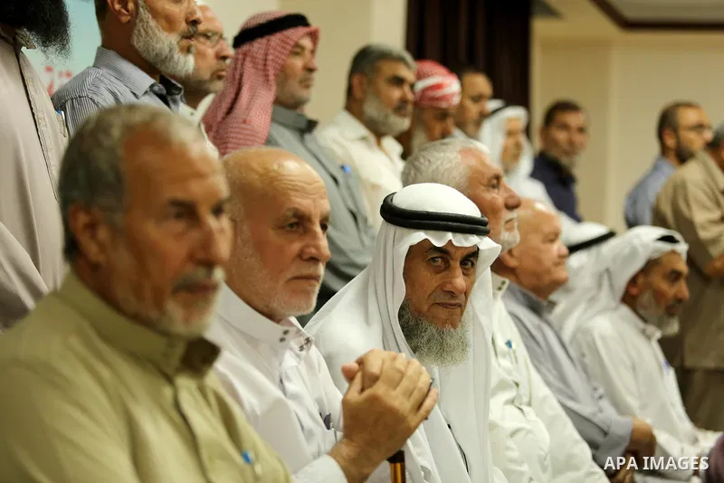Members of Palestine Scholars Association attend a press conference to show solidarity with Palestinians in Jerusalem, in Gaza city on July 30, 2017. Photo by Ashraf Amra
