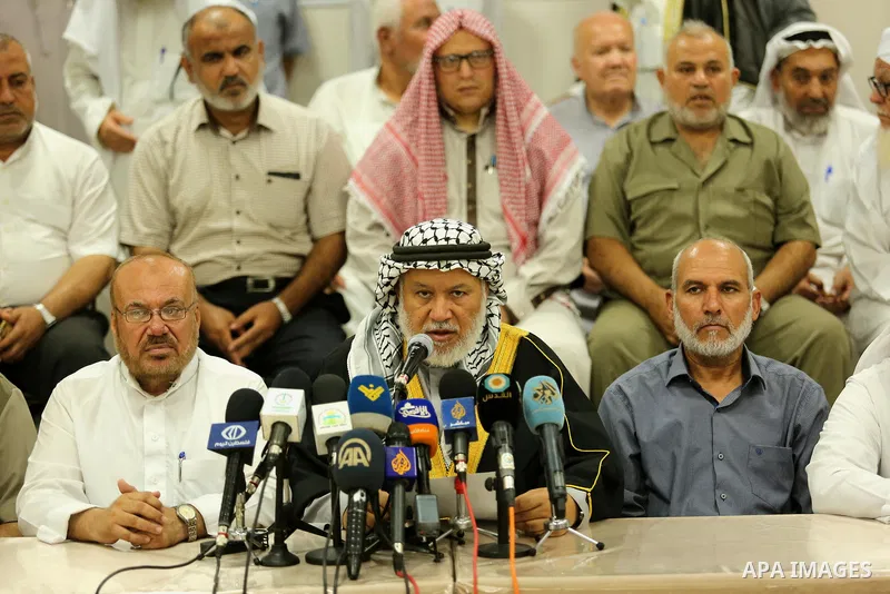 Marwan Abu Ras, a head of the Palestine Scholars Association, speaks during a press conference to show solidarity with Palestinians in Jerusalem, in Gaza city on July 30, 2017. Photo by Ashraf Amra
