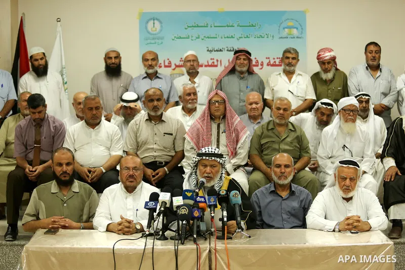 Marwan Abu Ras, a head of the Palestine Scholars Association, speaks during a press conference to show solidarity with Palestinians in Jerusalem, in Gaza city on July 30, 2017. Photo by Ashraf Amra