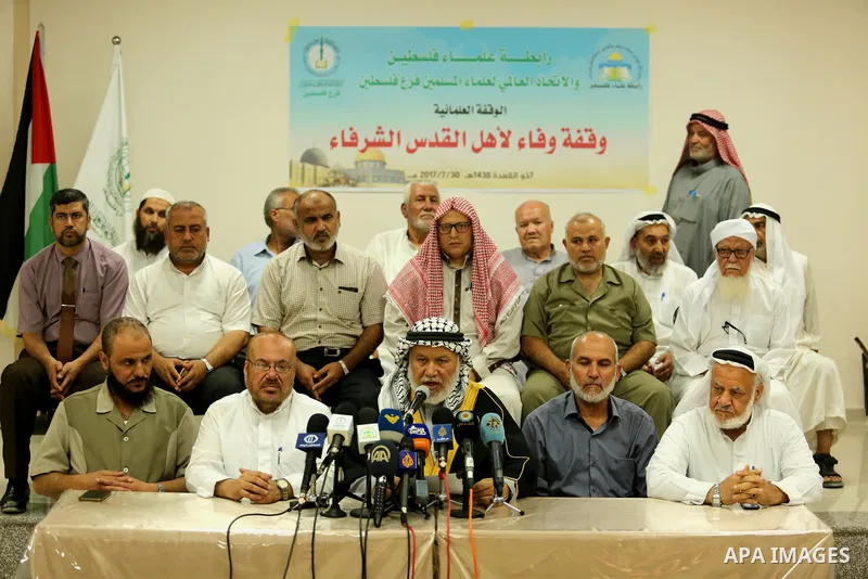 Marwan Abu Ras, a head of the Palestine Scholars Association, speaks during a press conference to show solidarity with Palestinians in Jerusalem, in Gaza city on July 30, 2017. Photo by Ashraf Amra