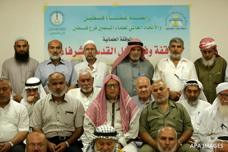 Members of Palestine Scholars Association attend a press conference to show solidarity with Palestinians in Jerusalem, in Gaza city on July 30, 2017. Photo by Ashraf Amra