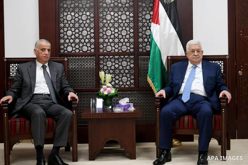 Palestinian President Mahmoud Abbas meets with a head of the supreme judicial council, advisor Emad Salim at his headquarter, in the West Bank city of Ramallah, on August 1, 2017. Photo by Osama Falah