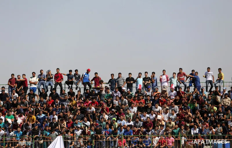 Fans of Shabab Rafah football club watch the first leg of the Palestine Cup final between Shabab Rafah and Hebron's Ahly al-Khalil football club at the Yarmouk Stadium in Gaza City on August 1, 2017. Photo by Ashraf Amra