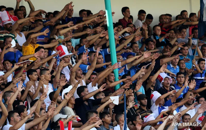 Fans of Shabab Rafah football club celebrate their team's victory against Hebron's Ahly al-Khalil football club in the first leg of the Palestine Cup final at the Yarmouk Stadium in Gaza City on August 1, 2017. Photo by...