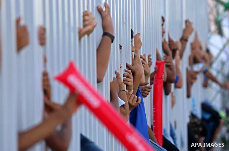 Fans of Shabab Rafah football club watch the first leg of the Palestine Cup final between Shabab Rafah and Hebron's Ahly al-Khalil football club at the Yarmouk Stadium in Gaza City on August 1, 2017. Photo by Ashraf Amra