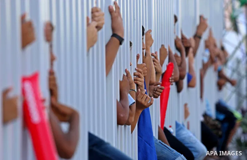 Fans of Shabab Rafah football club watch the first leg of the Palestine Cup final between Shabab Rafah and Hebron's Ahly al-Khalil football club at the Yarmouk Stadium in Gaza City on August 1, 2017. Photo by Ashraf Amra
