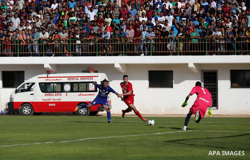 Players of Shabab Rafah football club compete with players of Hebron's Ahly al-Khalil football club in the first leg of the Palestine Cup final at the Yarmouk Stadium in Gaza City on August 1, 2017. Photo by Ashraf Amra
