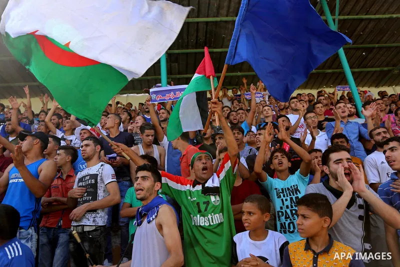Fans of Shabab Rafah football club watch the first leg of the Palestine Cup final between Shabab Rafah and Hebron's Ahly al-Khalil football club at the Yarmouk Stadium in Gaza City on August 1, 2017. Photo by Ashraf Amra