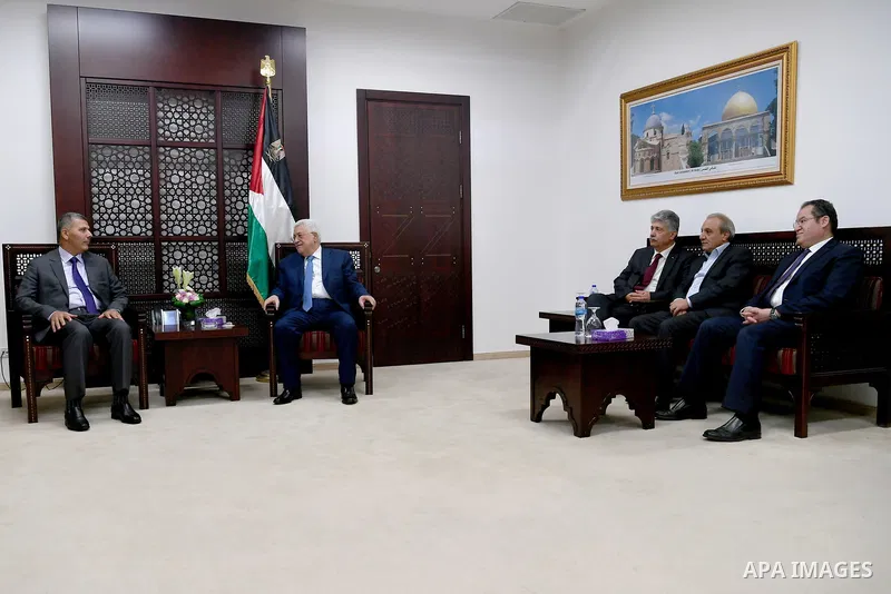 Palestinian President Mahmoud Abbas meets with a delegation from Hamas movement, at his headquarter in the West Bank city of Ramallah on August 01, 2017. Photo by Osama Falah