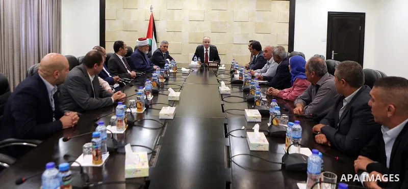Palestinian Prime Minister Rami Hamdallah meets with a delegation from Jenin governorate, at his office in the West Bank city of Ramallah on August 2, 2017. Photo by Prime Minister Office