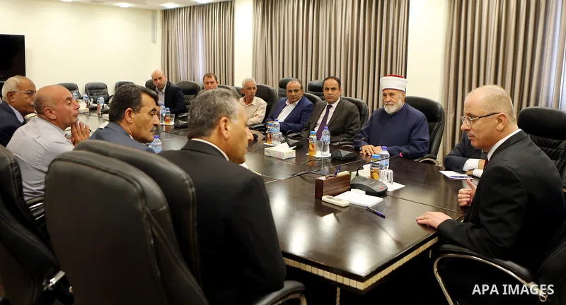 Palestinian Prime Minister Rami Hamdallah meets with a delegation from Jenin governorate, at his office in the West Bank city of Ramallah on August 2, 2017. Photo by Prime Minister Office